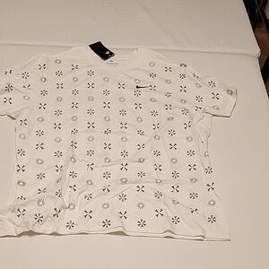 Nike White Tee with Black Swoosh and Repeating Floral Print